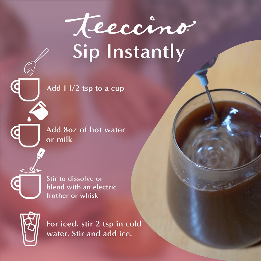 A single Monstera leaf in a clear glass vase against a white background.
