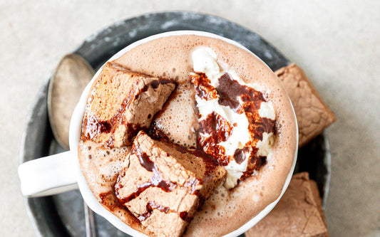 Homemade Cacao Mushroom Marshmallows in a mug of cocoa made with Teeccino Miraculous Mushrooms Cacao + 5