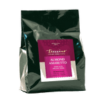 Teeccino Organic Almond Amaretto chicory herbal coffee in a pink and cream resealable bag, caffeine-free coffee alternative made with organic herbs.