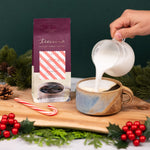 Teeccino Organic Candy Cane chicory herbal coffee in a red resealable bag, light roast, caffeine-free coffee alternative made with organic herbs.