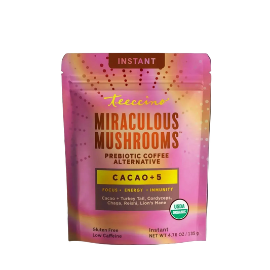 Front-facing pouch of Teecino Instant Miraculous Mushrooms Cacao +5 on a transparent background. The packaging features a warm terracotta upper section with the Teecino logo and “Mushroom Coffee Alternative” label. A central panel highlights Instant Miraculous Mushrooms with Cacao +5, listing turkey tail, cordyceps, reishi, chaga, and lion’s mane. The lower cream section notes low caffeine and prebiotic benefits, includes a USDA Organic seal, and shows a net weight of 4.76 ounces.